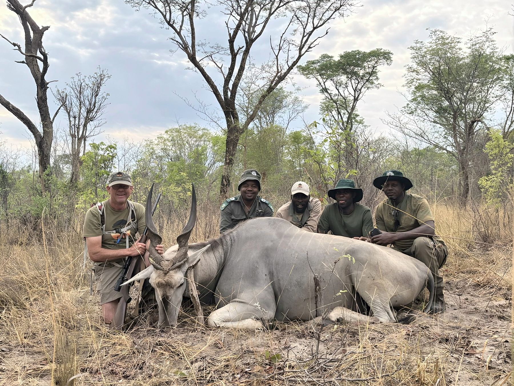 Hunting team with an eland