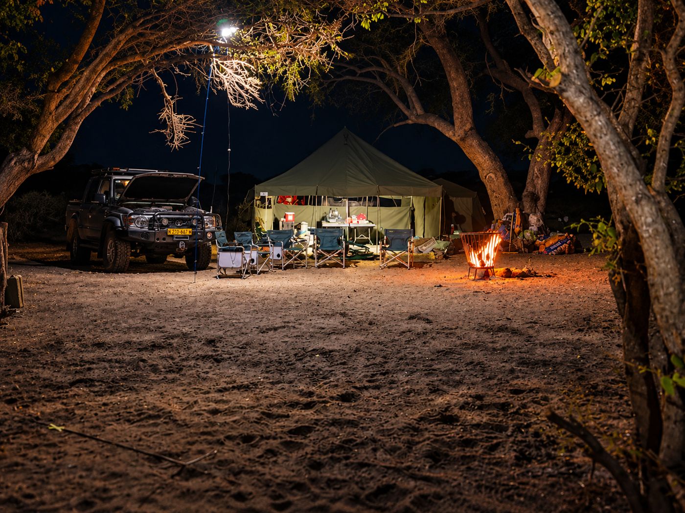 Canvas camp lit up at night